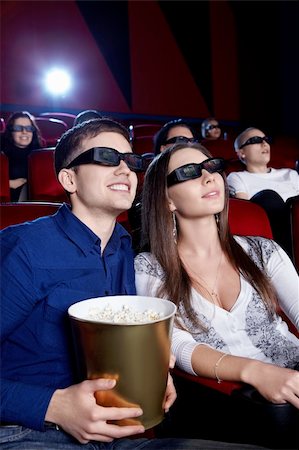 Young people in the 3D glasses at the cinema Stock Photo - Budget Royalty-Free & Subscription, Code: 400-06135923