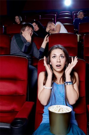 Surprised by the girl at the cinema Stock Photo - Budget Royalty-Free & Subscription, Code: 400-06135931