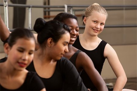 simsearch:400-06172148,k - Smiling young ballet student with her classmates Stock Photo - Budget Royalty-Free & Subscription, Code: 400-06136030