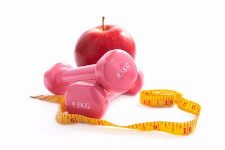 Fresh appetizing apple and colored dumbbells with a measuring tape. Stock Photo - Budget Royalty-Free & Subscription, Code: 400-06136225