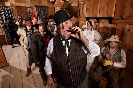 Big saloon owner with cigar and customers behind him Stock Photo - Budget Royalty-Free & Subscription, Code: 400-06136541