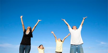 happy family watching the blue sky Stock Photo - Budget Royalty-Free & Subscription, Code: 400-06136641