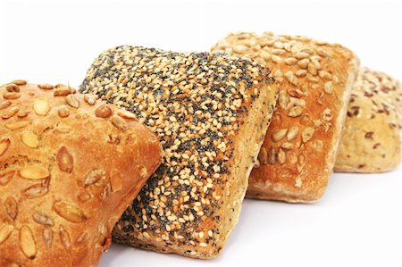 people eating bagels - Breads with different seeds isolated on white background. Photographie de stock - Aubaine LD & Abonnement, Code: 400-06136820