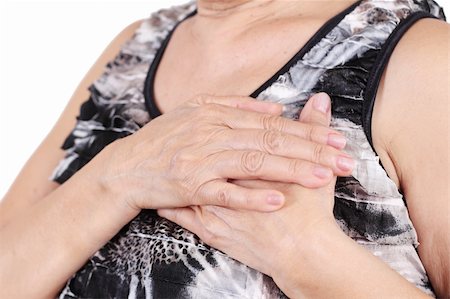 Close up of a senior woman's hand holding her chest. Photographie de stock - Aubaine LD & Abonnement, Code: 400-06136859