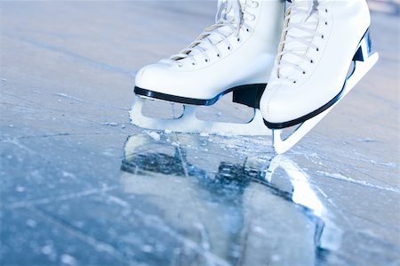 skating ice background - Tilted blue version, ice skates with reflection Stock Photo - Budget Royalty-Free & Subscription, Code: 400-06137118