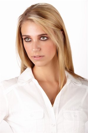 simsearch:400-06135888,k - Young adult caucasian woman with long blonde hair and green eyes wearing a plain white shirt with flawless skin and natural makeup. Photographie de stock - Aubaine LD & Abonnement, Code: 400-06137131