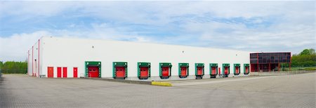 exterior ramp building - panoramic view of the front of an industrial warehouse with numbered red loading docks Stock Photo - Budget Royalty-Free & Subscription, Code: 400-06137200