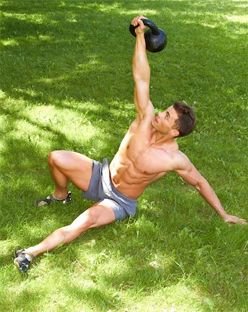 fitness model adult - Fitness Man Working with kettlebell at outdoor Stock Photo - Budget Royalty-Free & Subscription, Code: 400-06137442