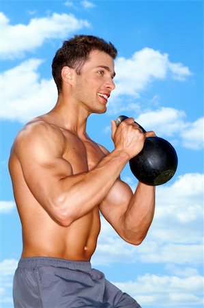 Muscular man working with weights at outdoor Stock Photo - Budget Royalty-Free & Subscription, Code: 400-06137453