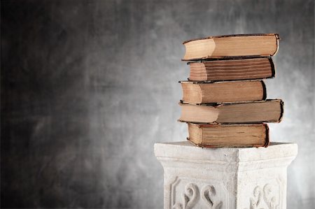 Stack of antique yellowed books on a plaster column. Stock Photo - Budget Royalty-Free & Subscription, Code: 400-06137539