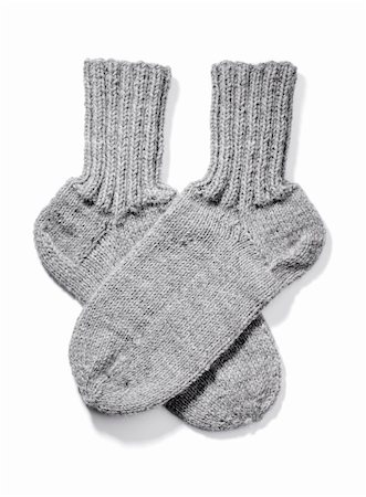 Hand-knitted warm wool socks isolated on white with natural shadows. Photographie de stock - Aubaine LD & Abonnement, Code: 400-06137547