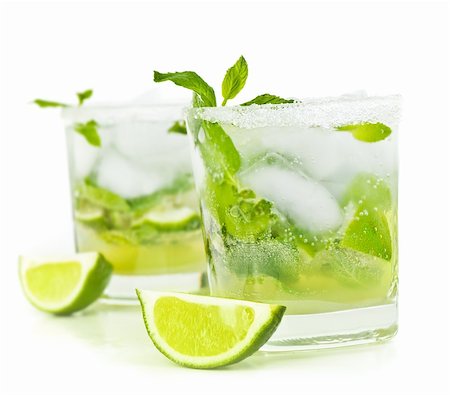 Cold mojito drink, glass of alcohol isolated over white background, fresh mint and lime fruit slice, food still life, party and holidays celebration Stock Photo - Budget Royalty-Free & Subscription, Code: 400-06137606