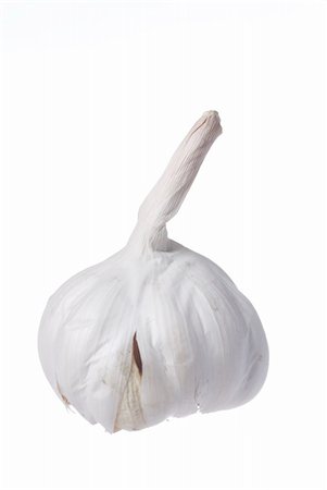 simsearch:400-05190028,k - One garlic on white background. Focus on Stalk. Foto de stock - Super Valor sin royalties y Suscripción, Código: 400-06137679