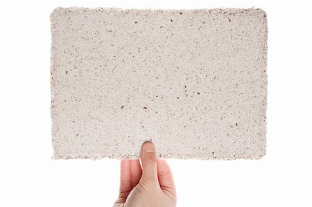 Handmade paper in woman hand isolated on white background Stock Photo - Budget Royalty-Free & Subscription, Code: 400-06137807