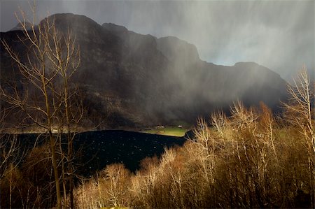 small, deep fjord in norway in changeful weather with cloudy sky Photographie de stock - Aubaine LD & Abonnement, Code: 400-06138290