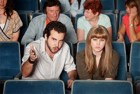 simsearch:400-05913577,k - Serious movie fans angry in a theater Stock Photo - Budget Royalty-Free & Subscription, Code: 400-06138375