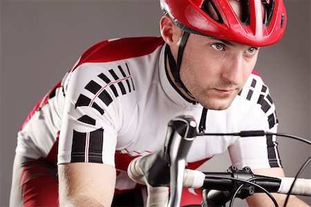 fully equipped cyclist riding a bicycle Foto de stock - Royalty-Free Super Valor e Assinatura, Número: 400-06138755