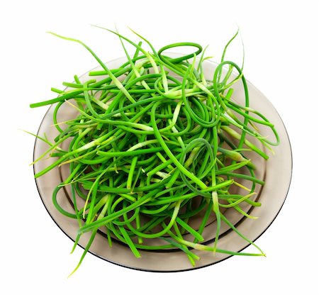 simsearch:400-04393618,k - Fresh garlic scapes on plate. Isolated on white background. Foto de stock - Royalty-Free Super Valor e Assinatura, Número: 400-06138783