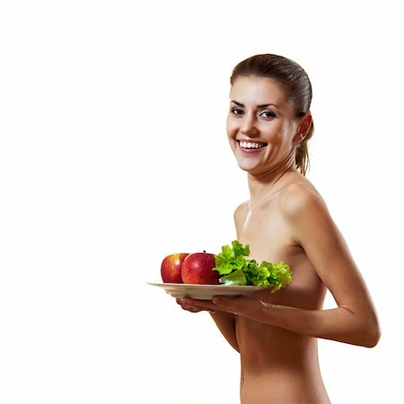 Beautiful young woman holding plate with apples and lettuce. Healthy eating concept. Stock Photo - Budget Royalty-Free & Subscription, Code: 400-06138795