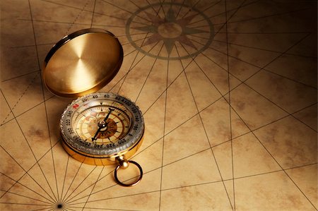 simsearch:400-04908052,k - Close up view of the Compass on the old paper background Stockbilder - Microstock & Abonnement, Bildnummer: 400-06138886