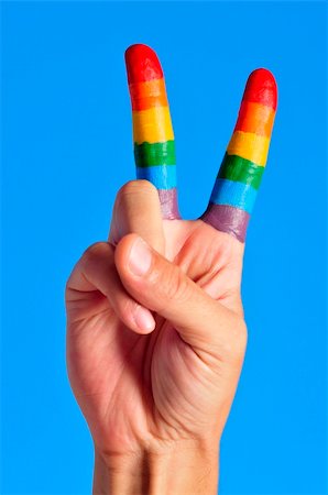 a hand making the V sign with fingers painted as the rainbow flag Stock Photo - Budget Royalty-Free & Subscription, Code: 400-06139168