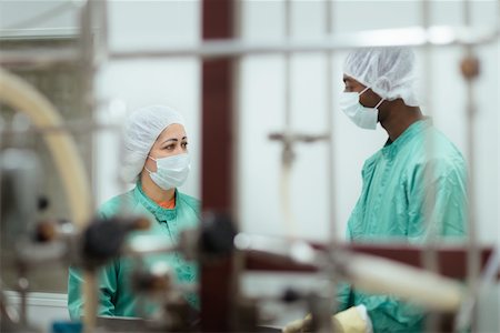 Laboratory technicians at work in medical plant with machinery and computers Stock Photo - Budget Royalty-Free & Subscription, Code: 400-06139326