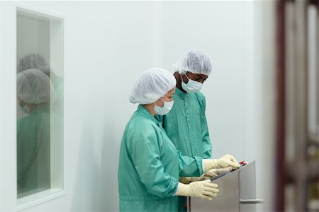 Laboratory technicians at work in medical plant with machinery and computers Stock Photo - Budget Royalty-Free & Subscription, Code: 400-06139328