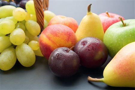 simsearch:400-08110532,k - Mix of fresh ripe fruits close-up: plums, peaches, pears, apples and grapes on neutral background. Stock Photo - Budget Royalty-Free & Subscription, Code: 400-06139374