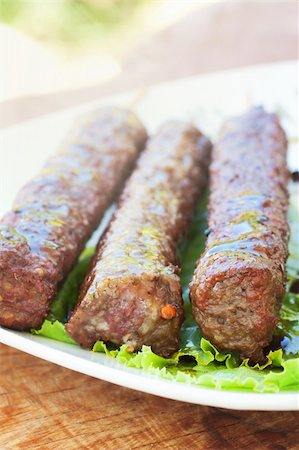 simsearch:400-07713408,k - Barbecue meat kebab served on a lettuce Stock Photo - Budget Royalty-Free & Subscription, Code: 400-06139541