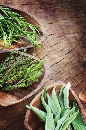 simsearch:400-06531157,k - Fresh aromatic herbs on old wooden background. Rosemary, thyme and sage Foto de stock - Royalty-Free Super Valor e Assinatura, Número: 400-06139542