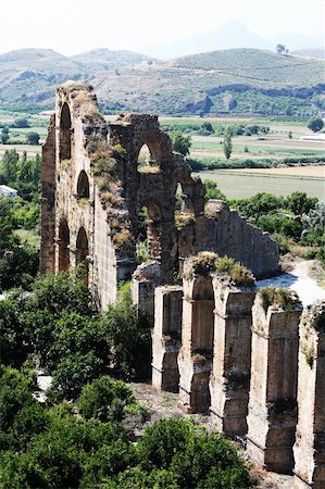 Old water aqueduct device near theater Aspendos in Antalya, archeology background. Constructed by Greece architect Eenon during time of Mark Aurelius Stock Photo - Budget Royalty-Free & Subscription, Code: 400-06139675