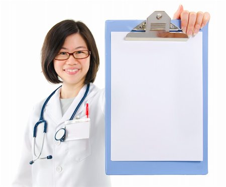 simsearch:400-06142860,k - Asian female doctor showing blank writing pad on white background Fotografie stock - Microstock e Abbonamento, Codice: 400-06139726