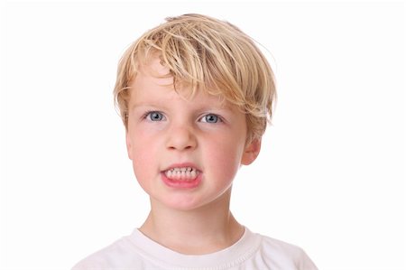 simsearch:400-07506232,k - Portrait of an angry young boy on white background Stock Photo - Budget Royalty-Free & Subscription, Code: 400-06139781