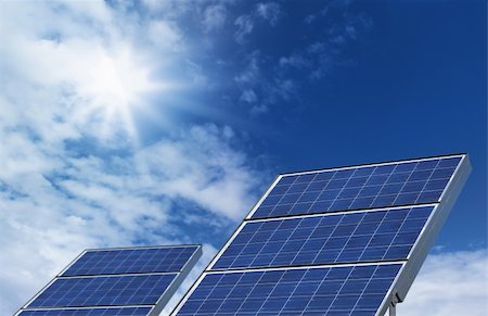 simsearch:400-04876815,k - Two solar panel photovoltaic source on blue skyt background Photographie de stock - Aubaine LD & Abonnement, Code: 400-06139805