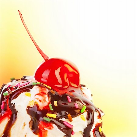 Ice cream border, frozen sweet yogurt topped with chocolate and strawberry syrup, decorated with cherry berry, delicious sweets design with white text space Stock Photo - Budget Royalty-Free & Subscription, Code: 400-06139811