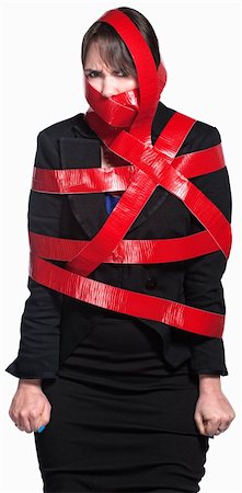 Angry female executive tied up in red tape Stock Photo - Budget Royalty-Free & Subscription, Code: 400-06139900