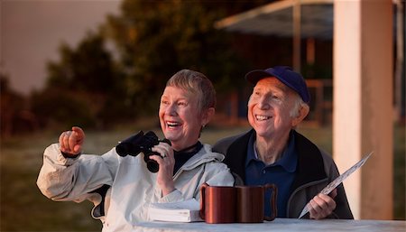 simsearch:400-08679589,k - Happy elderly bird watchers outside in jackets Foto de stock - Super Valor sin royalties y Suscripción, Código: 400-06139917