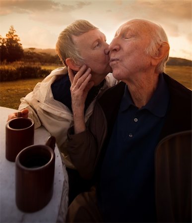 simsearch:400-06139916,k - Nice senior woman kisses her husband outside Stock Photo - Budget Royalty-Free & Subscription, Code: 400-06139926