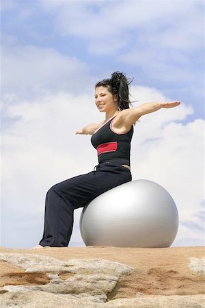 simsearch:400-05062836,k - Girl using a pilates ball Stock Photo - Budget Royalty-Free & Subscription, Code: 400-06130440
