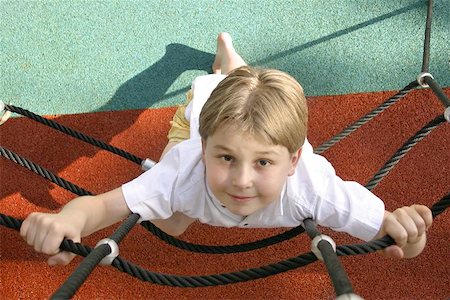 Young boy on climbing ropes - playground  Above view looking down. Stock Photo - Budget Royalty-Free & Subscription, Code: 400-06130549