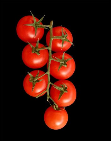 potassium - Seven red ripe tomatoes on the vine, on a black background Stock Photo - Budget Royalty-Free & Subscription, Code: 400-06131085