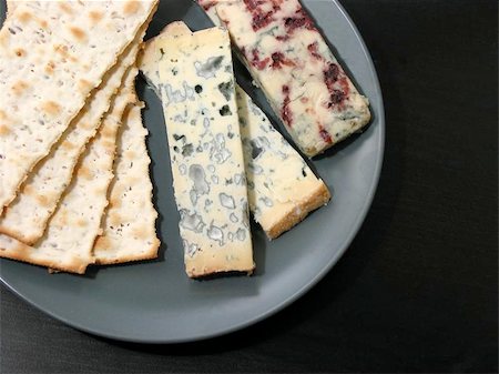 Blue cheese on a plate, on dark background Stock Photo - Budget Royalty-Free & Subscription, Code: 400-06131457