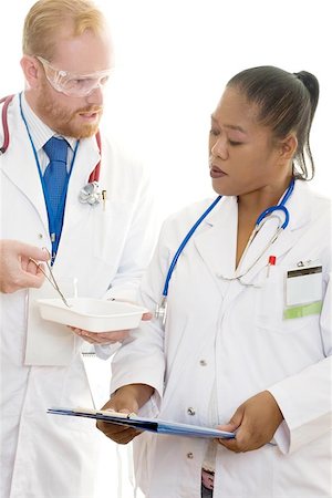 Two doctors discussing medical practice.  Diversity in the workplace, teamwork, meeting Stock Photo - Budget Royalty-Free & Subscription, Code: 400-06131750