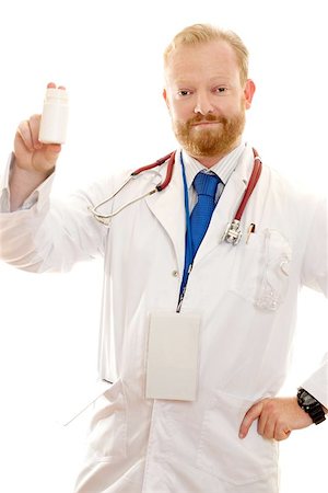 simsearch:400-04508758,k - Hospital worker holding a blank bottle of pills, vitamins, pharmaceuticals. Foto de stock - Super Valor sin royalties y Suscripción, Código: 400-06131810