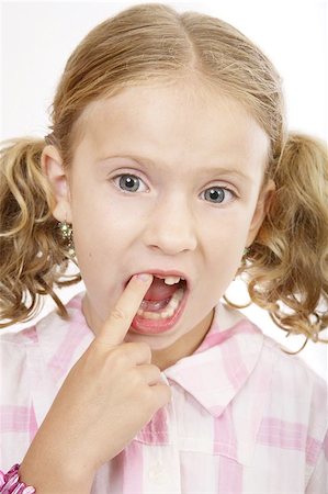 Girl missing tooth Stock Photo - Budget Royalty-Free & Subscription, Code: 400-06131960