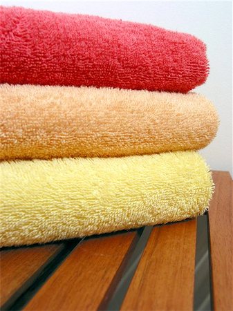 simsearch:400-06133108,k - Stack of bright colorful clean towels on a wooden bench Stock Photo - Budget Royalty-Free & Subscription, Code: 400-06132567
