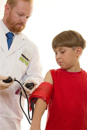 simsearch:400-04508758,k - Doctor taking a young patient's blood pressure Foto de stock - Super Valor sin royalties y Suscripción, Código: 400-06132808