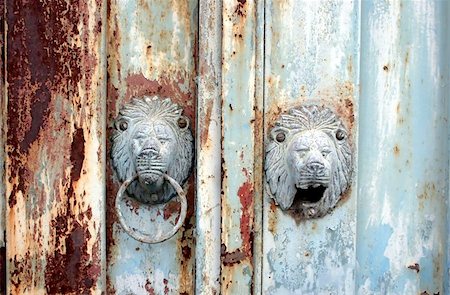 dry corrosion - Beautiful old rusty blue gate with lion head knocker Stock Photo - Budget Royalty-Free & Subscription, Code: 400-06132977