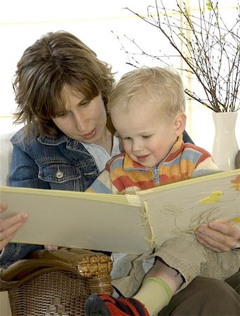 Mother and son reading a book on a chair Stock Photo - Budget Royalty-Free & Subscription, Code: 400-06133140