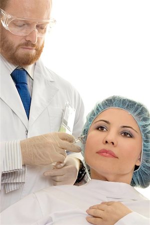 simsearch:400-04221790,k - Botox®, is a popular non-surgical injection that temporarily reduces or eliminates frown lines, forehead creases, crows feet near the eyes and thick bands in the neck. The toxin blocks the nerve impulses, temporarily paralyzing the muscles that cause wrinkles while giving the skin a smoother, more refreshed appearance. Photographie de stock - Aubaine LD & Abonnement, Code: 400-06133227